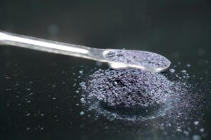 Potassium permanganate crystals on metal spoon for survival use