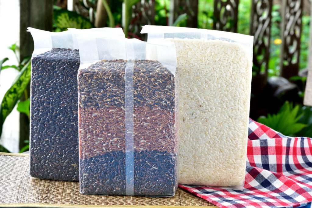 Sealed bags of rice varieties stored for long-term food security in emergencies.
