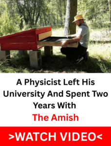 Amish man in straw hat building a wooden solar food dehydrator in a field