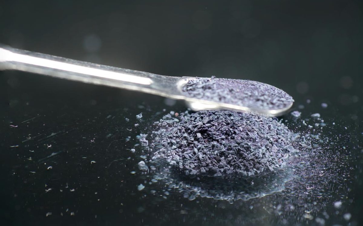 Potassium permanganate crystals on metal spoon for survival use
